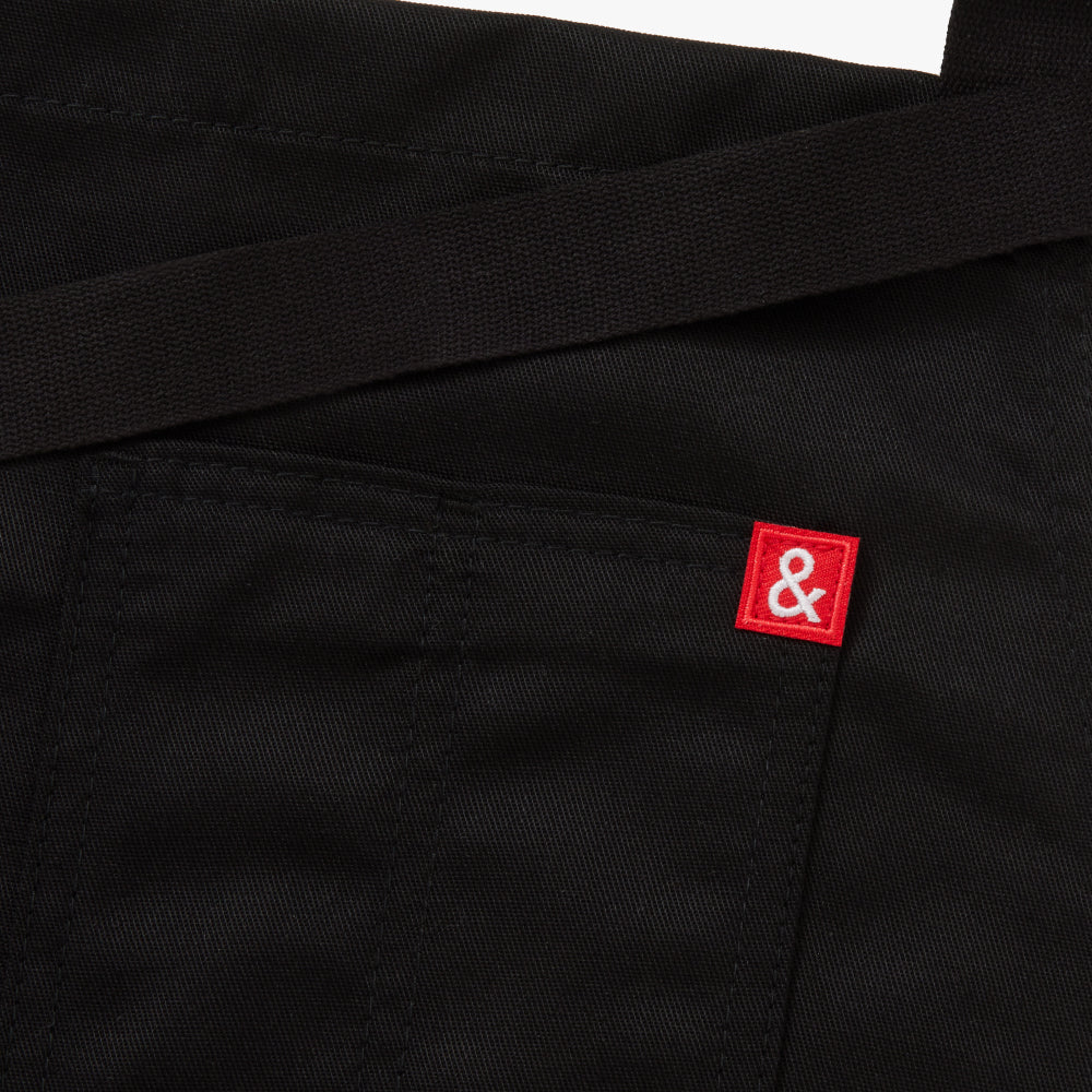 Built on our classic apron silhouette, the Restaurant Apron is paired back for simplicity. The Restaurant Apron is crafted with durable Poly Cotton fabric, and features 100% cotton webbing waist straps, neck strap, and towel loop.