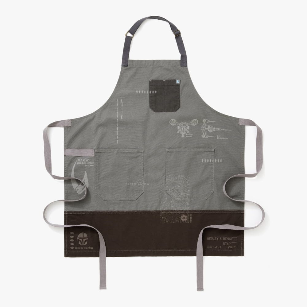 https://industry.hedleyandbennett.com/cdn/shop/files/Star-Wars-Mandalorian-Apron-1_59f0fe29-44fc-4c15-9359-de6ddcddd85e.jpg?v=1697745863